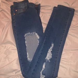 High waisted distressed jeans